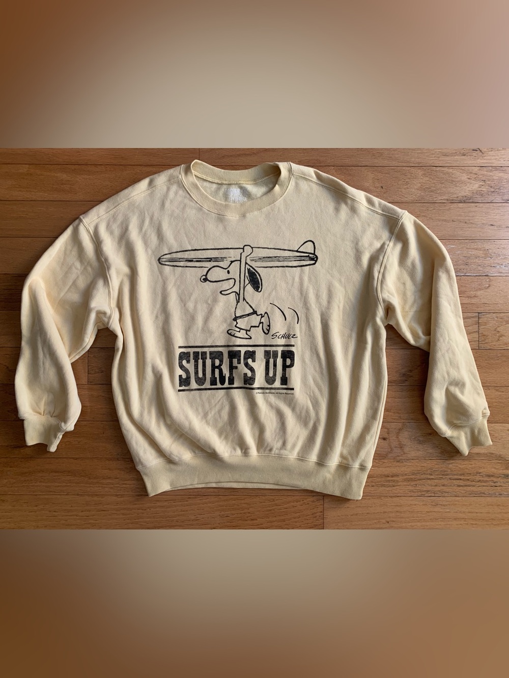 Peanuts Yellow Crewneck Sweatshirt with Black Snoopy "Surfs Up" Graphic